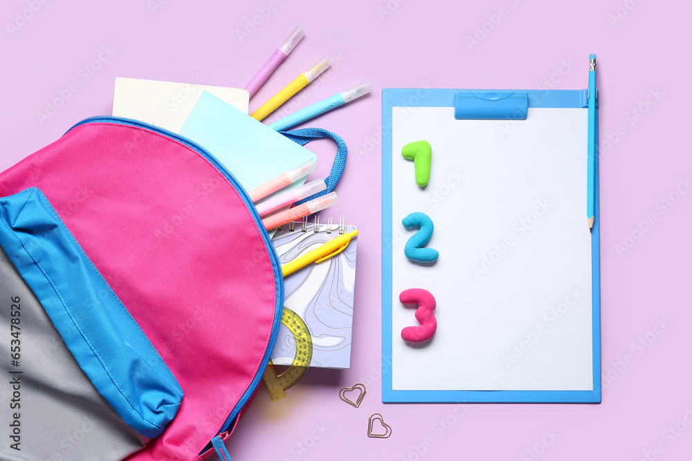 Stylish school backpack with different stationery on color background