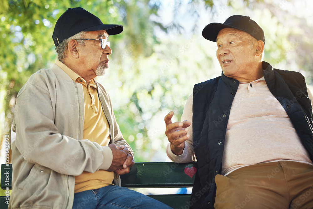 Elderly men, park and communication with friendship, nature and conversation with bonding on bench. Diversity, closeup and old people with community for socialize, relaxation and discussion on life