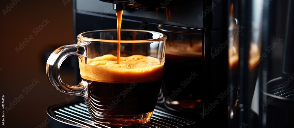 Breakfast beverage made with espresso in see through mug using automatic coffee machine