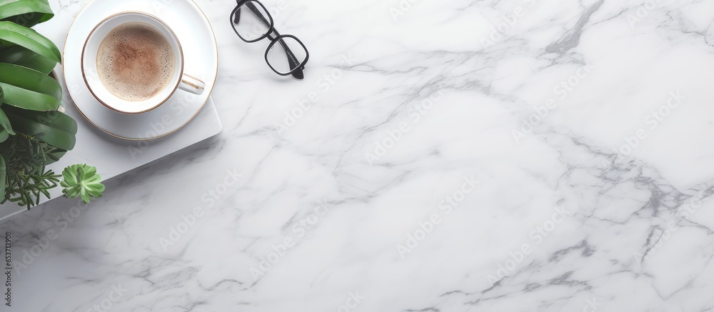 Marble office desk with technology coffee and workspace design top view closeup