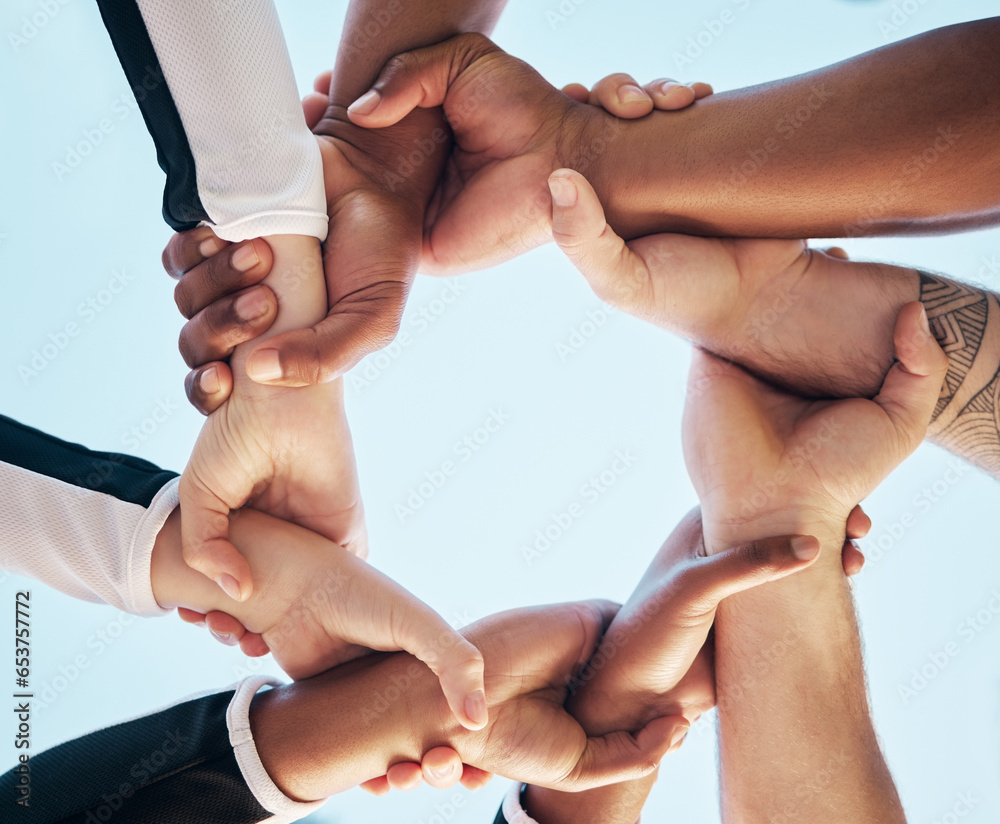 Hands, link or chain with people on team, collaboration and solidarity with support and connection low angle. Community, synergy and huddle with mission in group, meeting and communication of goals