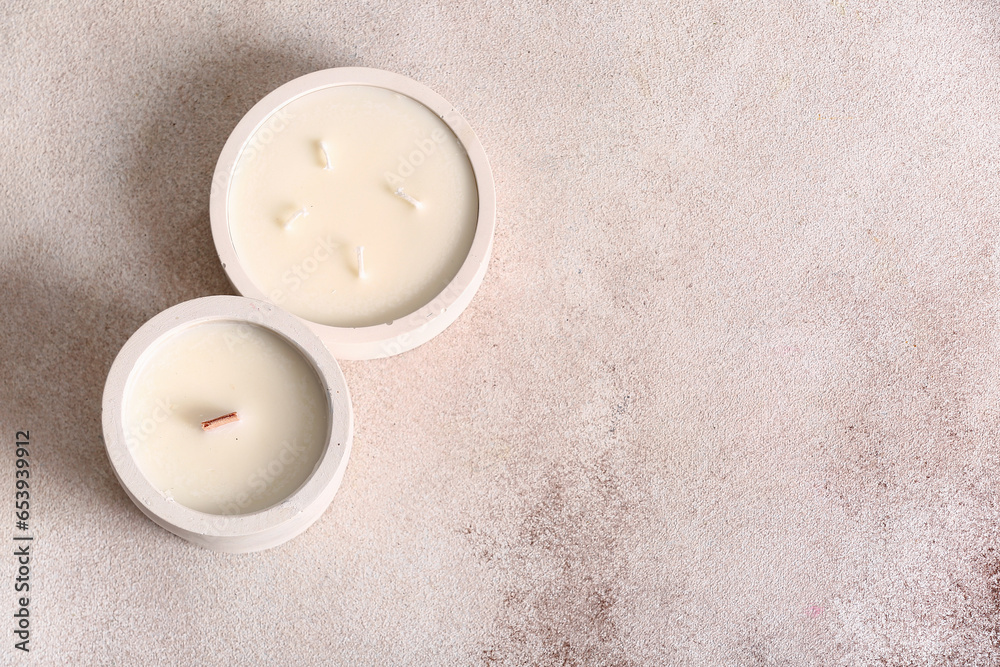 Holders with candles on white background