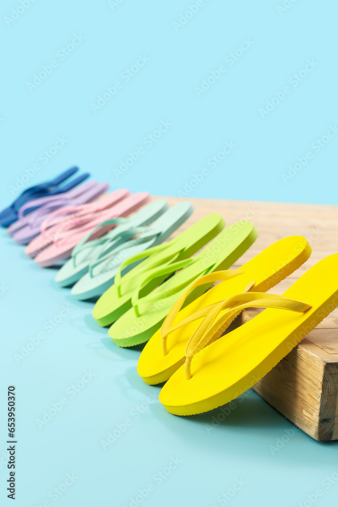 Many different flip-flops on blue background