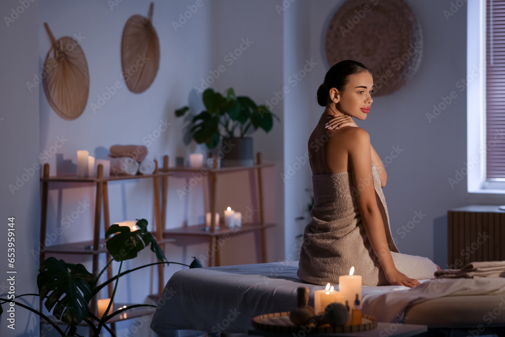 Pretty young woman in spa salon