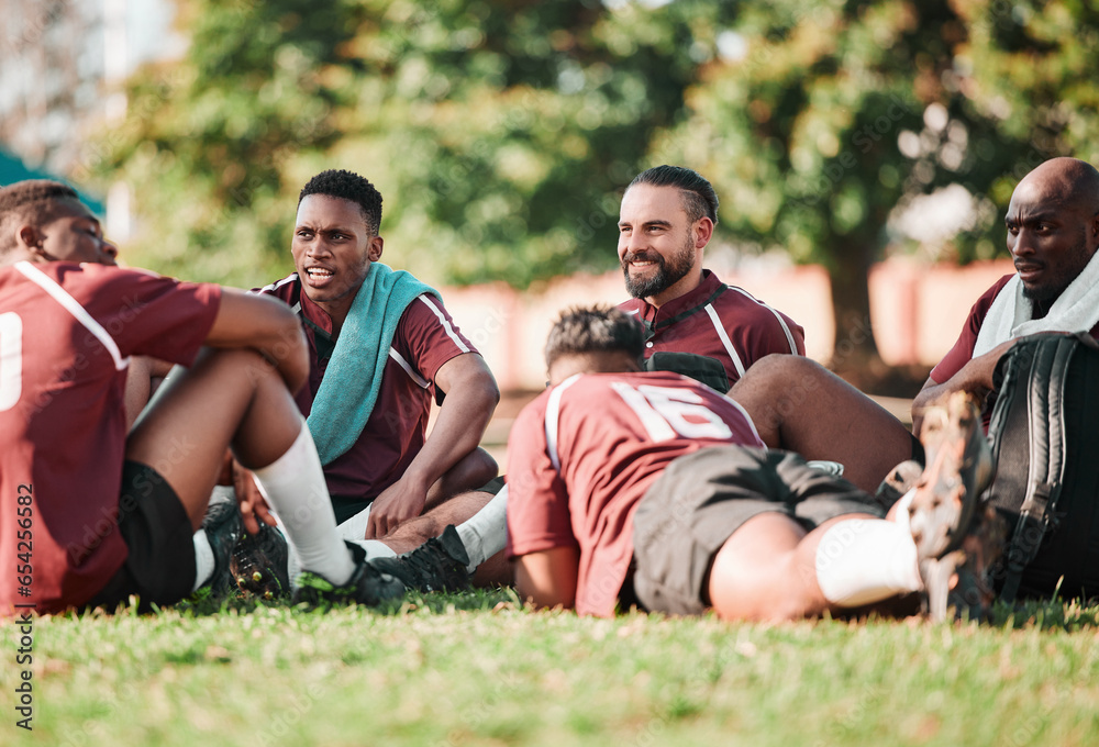 Sports, training and people or rugby players in a circle for planning strategy for game or match. Fitness, group and athletes talking for team building and relax on an outdoor field for practice