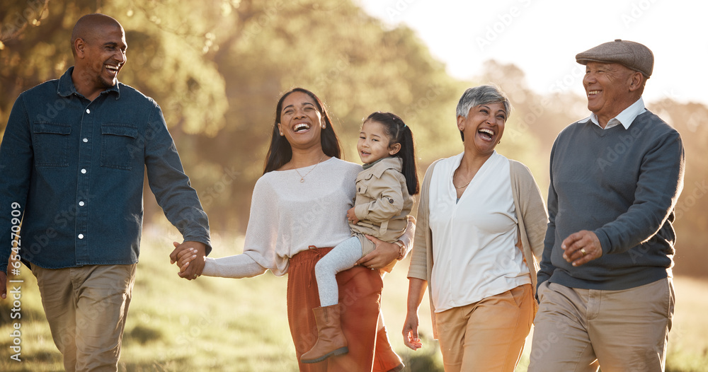 Parents, child and happy outdoor with grandparents, holding hands and comic laugh with conversation. Men, women and kid on walk in nature, funny memory and bonding with love, vacation or care in park