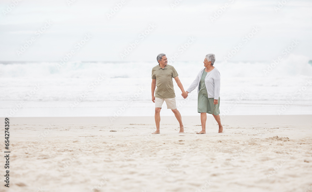 Senior, couple and hand holding on the beach for retirement vacation, holiday or adventure in summer. Elderly, man and woman for walking by ocean or sea with journey and happiness for relax and love