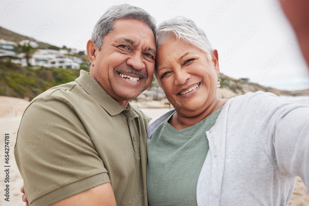 Senior, couple and selfie on beach for travel, vacation or retirement in nature with happiness and profile picture. Elderly, man or woman with portrait smile for holiday or adventure update by ocean