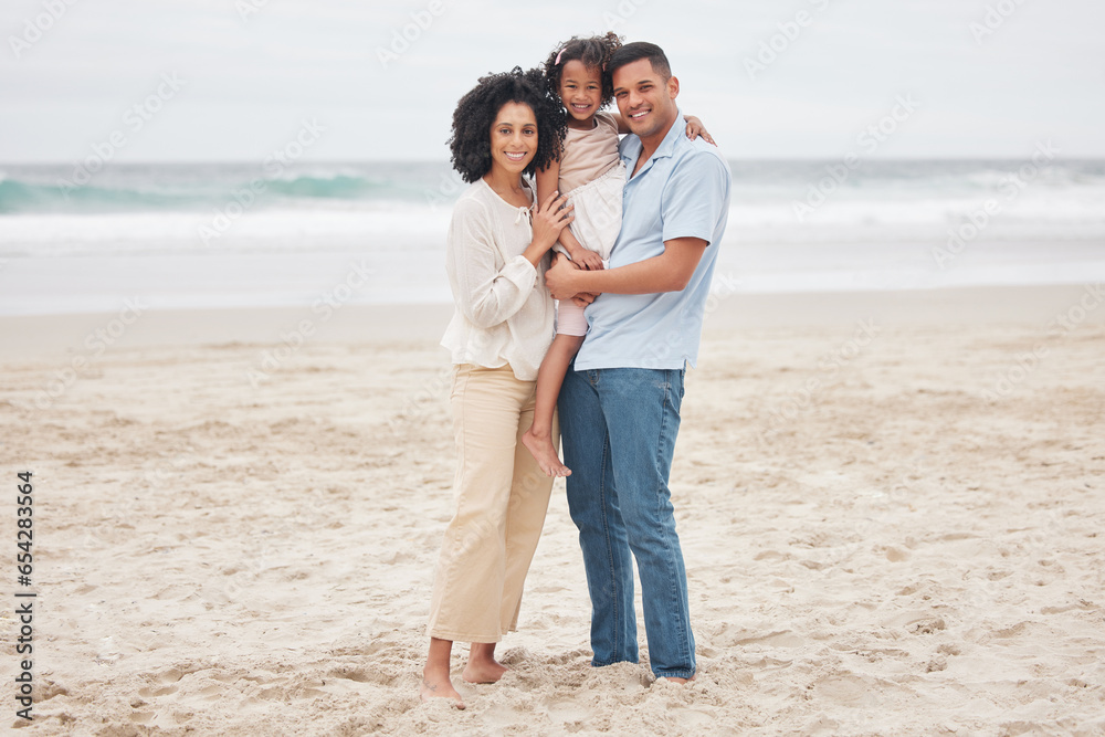 Hug, portrait and a family at the beach for a vacation, travel or walking by the ocean. Happy, care and a young mother, father and girl kid at the sea for a holiday, bonding or together in summer