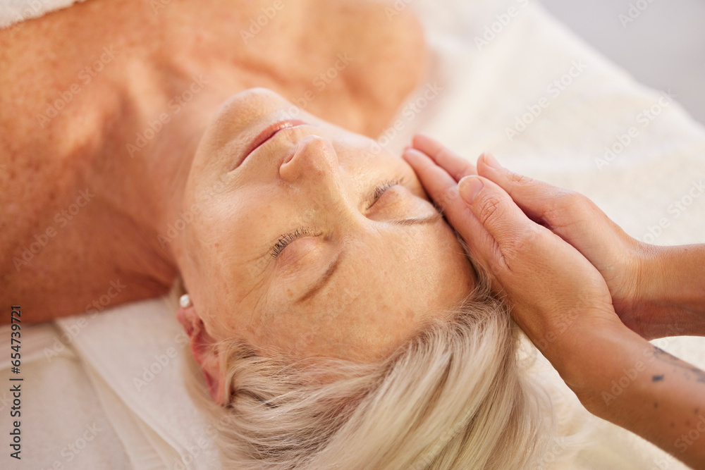 Relax, face massage and senior woman at a spa for luxury, self care and facial healing treatment. Health, wellness and elderly female person on a retirement retreat for head therapy at natural salon.