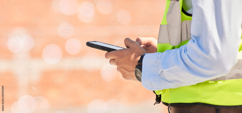 Hands of engineer on construction site, typing on phone and checking email for building schedule with mockup. Architecture, communication and business man with cellphone reading text, chat or report.