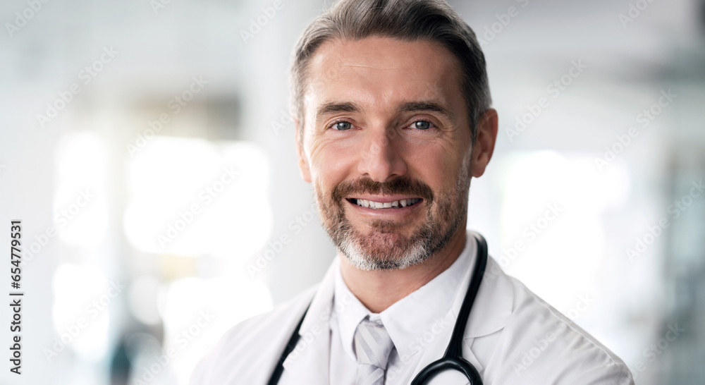 Mature doctor, portrait and happy man in hospital for healthcare, wellness and career in clinic. Face, medical professional smile and confident expert surgeon, therapist worker and employee in Canada