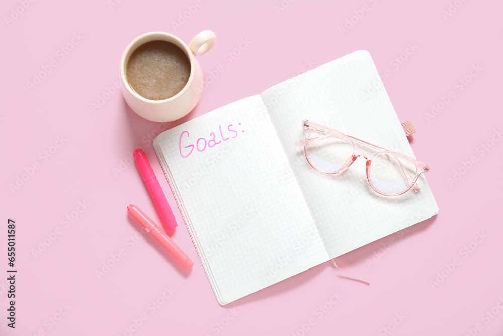 Notebook with empty to do list, eyeglasses and cup of coffee on pink background. New year goals