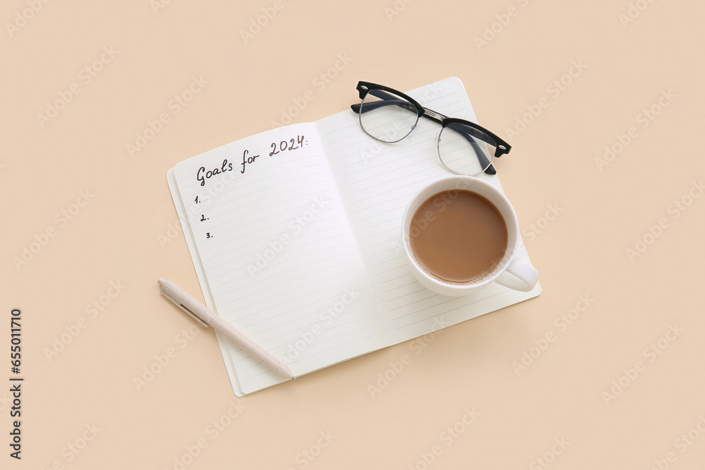 Notebook with empty to do list, eyeglasses and cup of coffee on beige background. New year goals