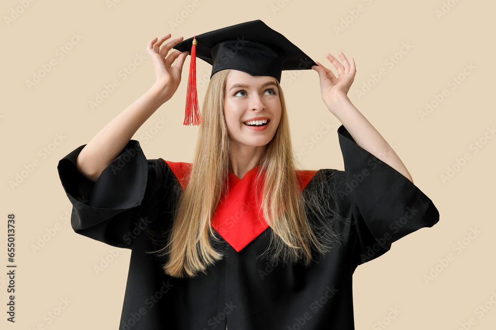 Female graduate student on beige background