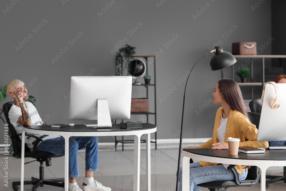 Young programmers working in office