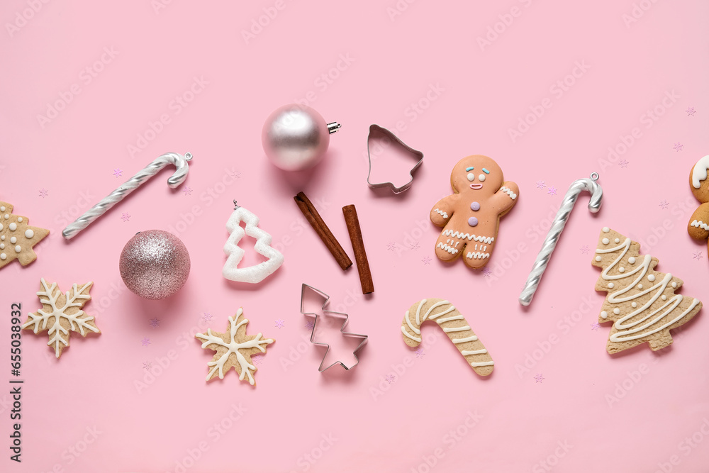 Composition with Christmas cookies and beautiful decorations on pink background