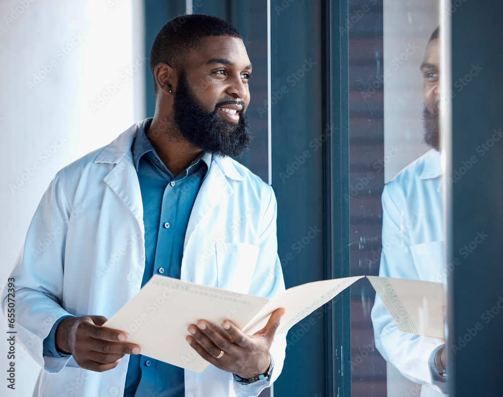 Doctor, black man and thinking of healthcare information, paperwork or documents by window in building with smile. Person, professional or person thoughtful of notes or charts on paper with ideas