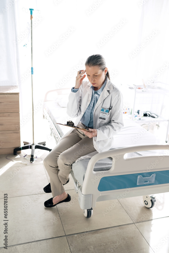 Doctor, woman and thinking with clipboard at clinic for patient data, checklist and medical results with notes. Healthcare, professional or person with documents for information or planning on chart