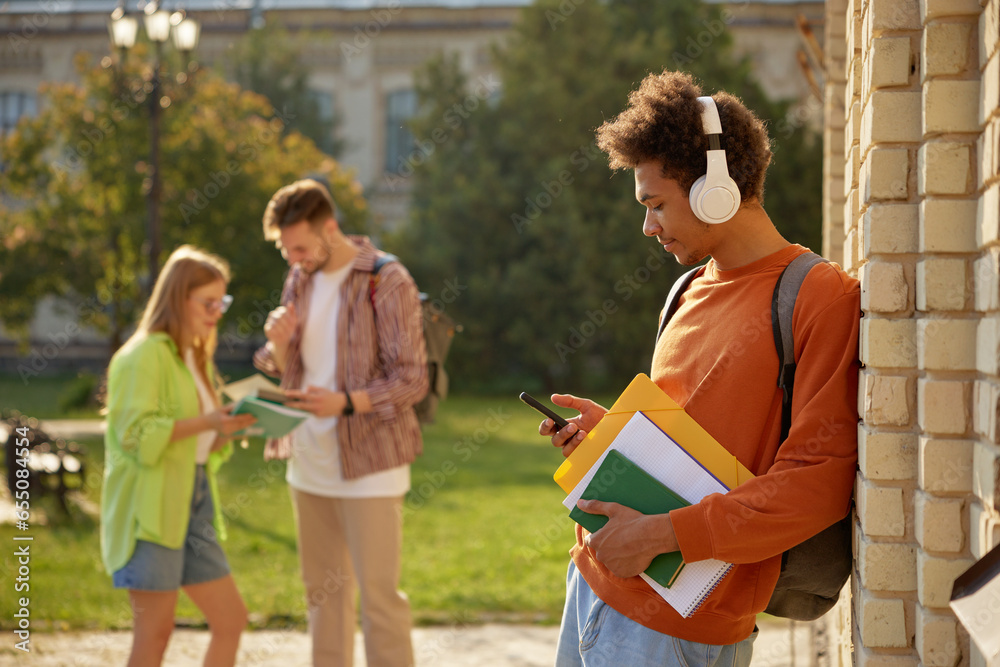 Teenager students at university campus after day of class