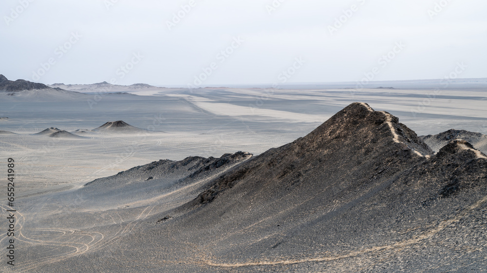 landforms of black mountain peaks which are like moon surfaces. Panorama photo.