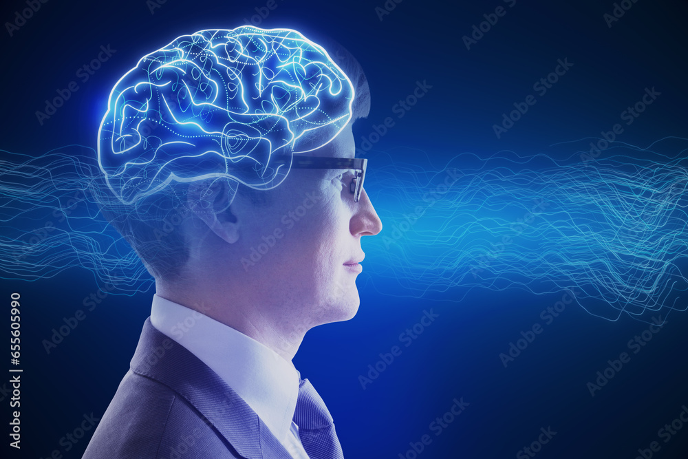 Side portrait of attractive young businessman with creative digital brain hologram on blue background. Hi-tech innovation and AI concept.