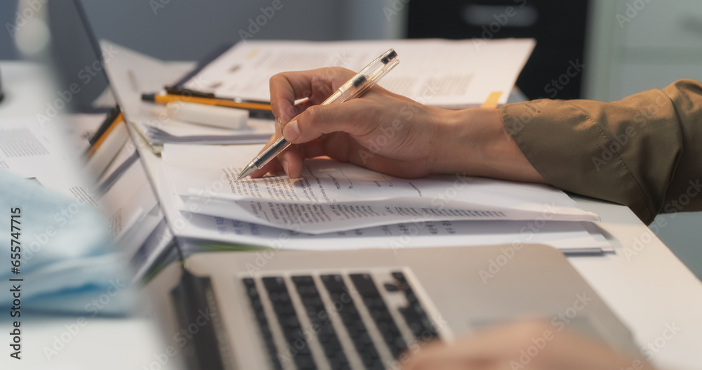 Close Up of a Document Controllers Hands Focused on the Laptop Computer Keyboard, Skillfully Managing, Organizing and Processing Critical Documents for Seamless Workflow