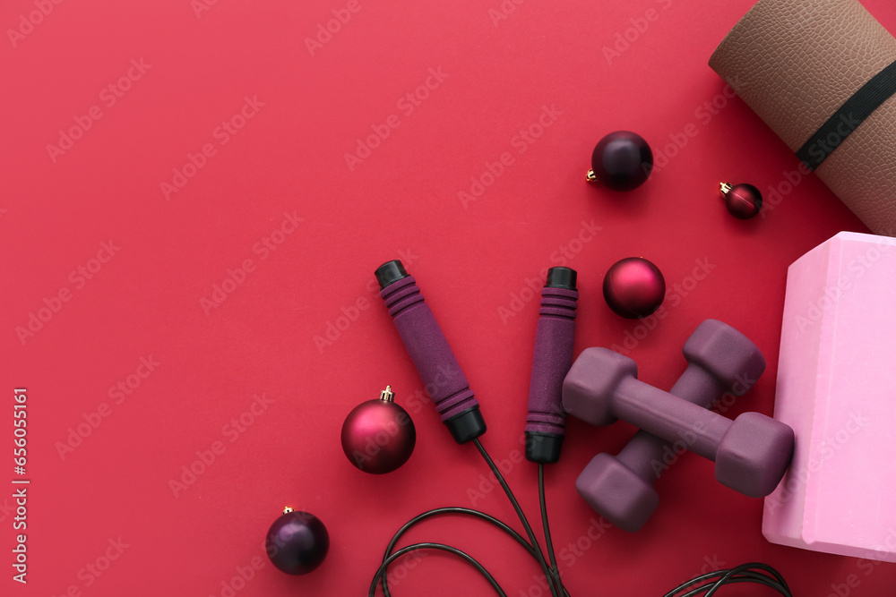 Sports equipment with Christmas decor on red background