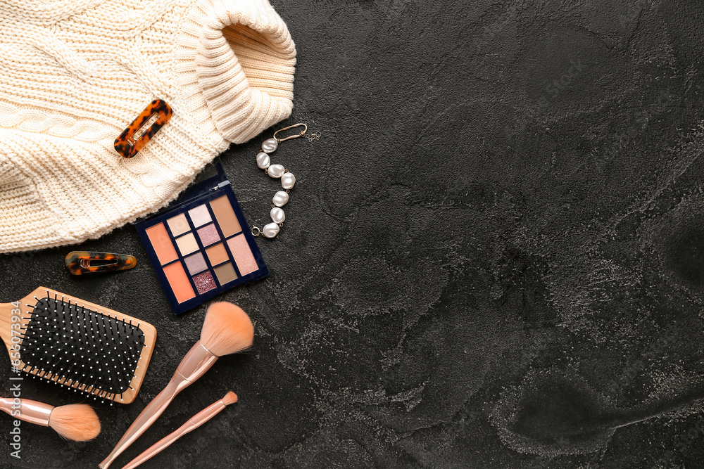 Composition with female accessories, cosmetics and clothes on dark background