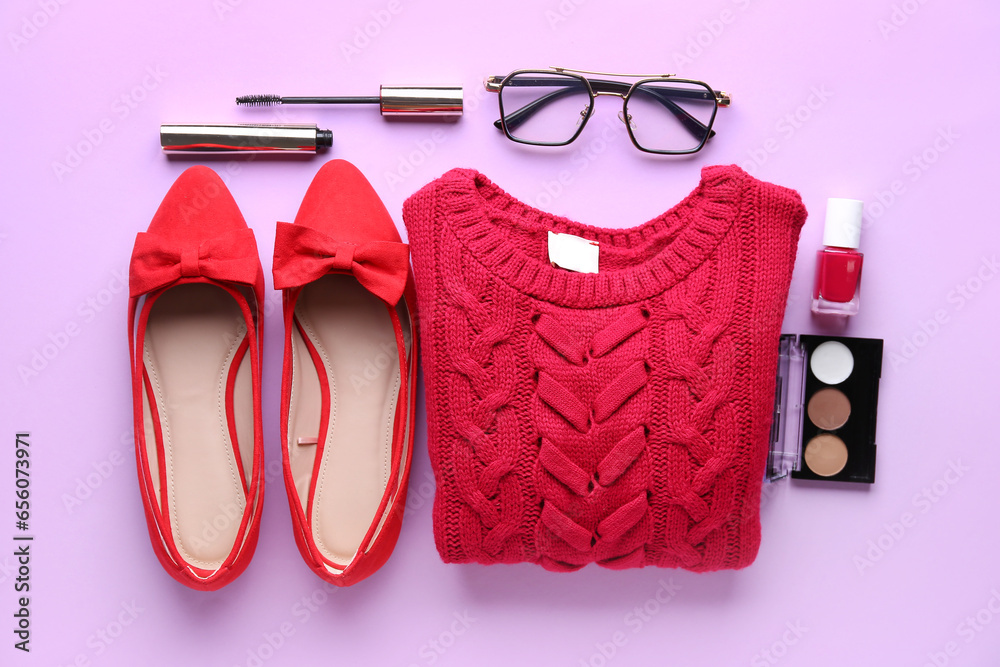 Composition with cosmetics, shoes and clothes on lilac background