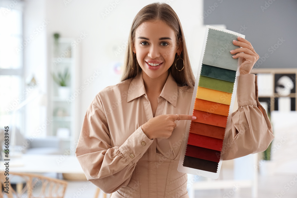 Female interior designer with fabric samples in office