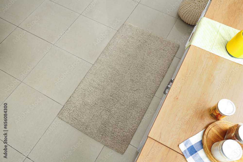 Interior of light kitchen with soft carpet, top view