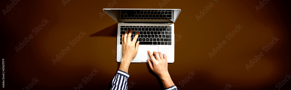 Person using a laptop computer from above