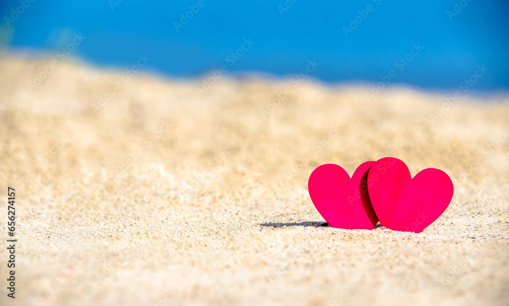 romantic symbol of two hearts on the beach 