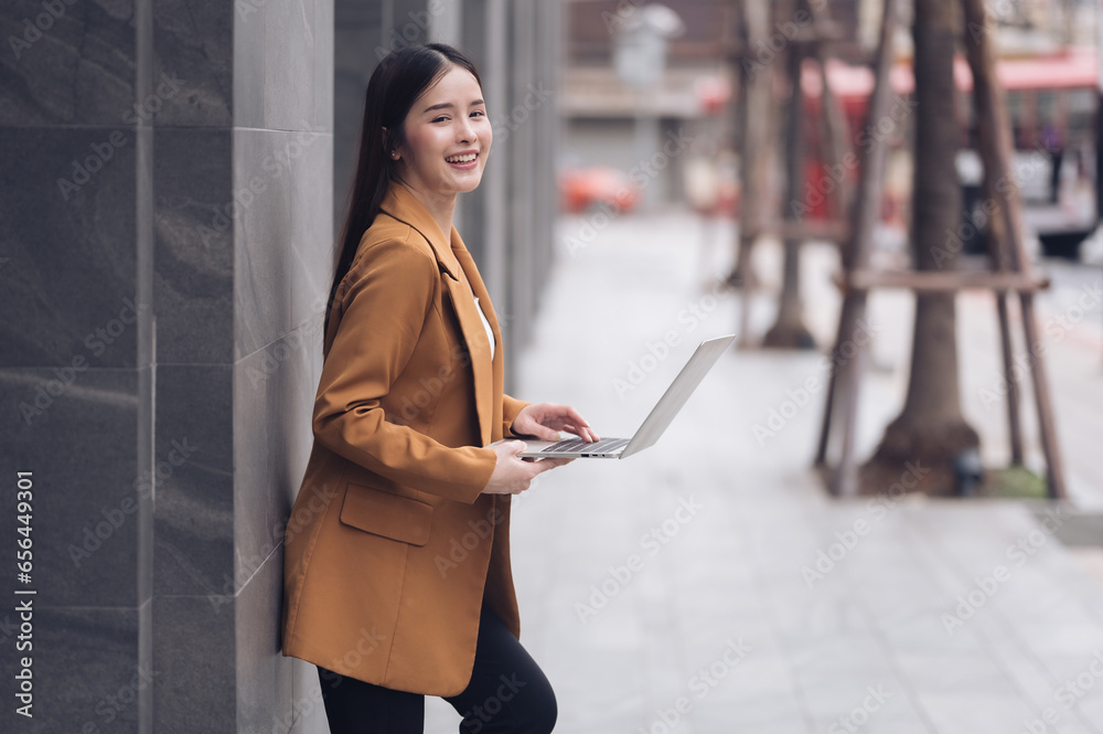 Successful businesswoman standing outside office meeting building from various working nations.