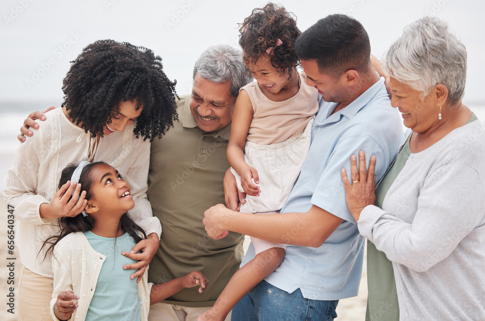 Beach, big family or happy grandparents with children in nature to enjoy holiday vacation in New Zealand. Travel, hug or proud father at sea or ocean with kids, care or mom to relax or bond together