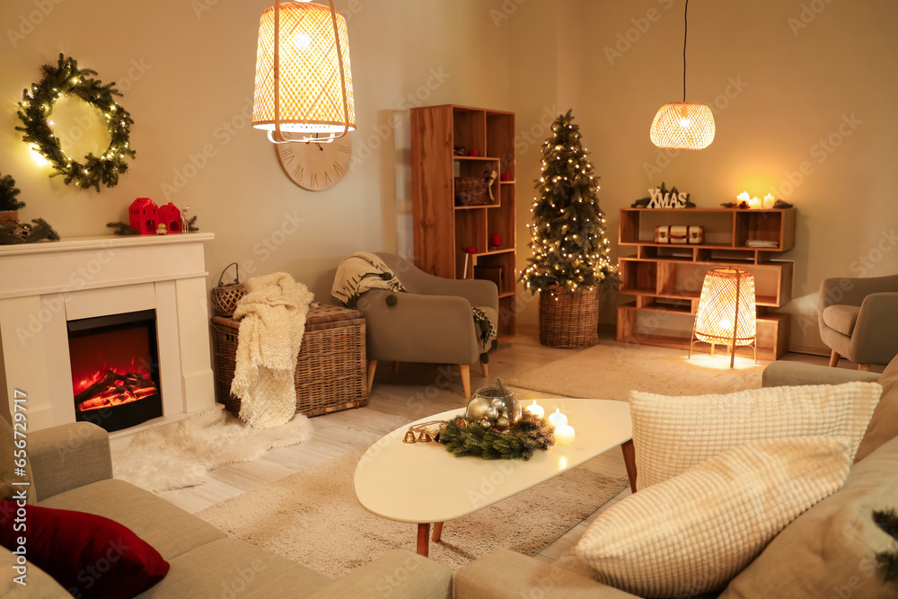 Interior of festive living room with fireplace, Christmas decor and glowing lamps