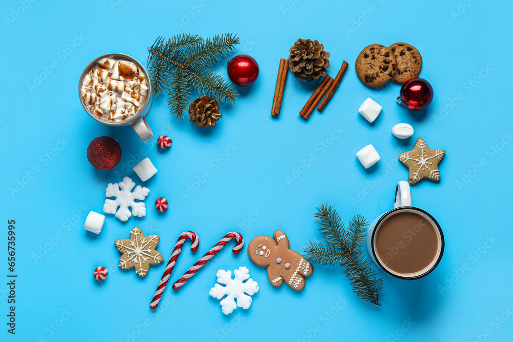 Frame made of tasty cookies, cocoa with marshmallows, candy canes, fir branches, cinnamon, Christmas balls and snowflakes on blue background