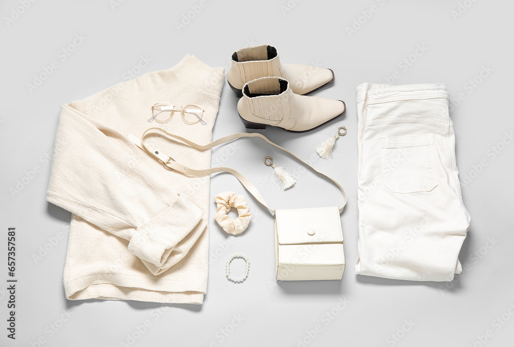 Composition with stylish female clothes, accessories and shoes on grey background