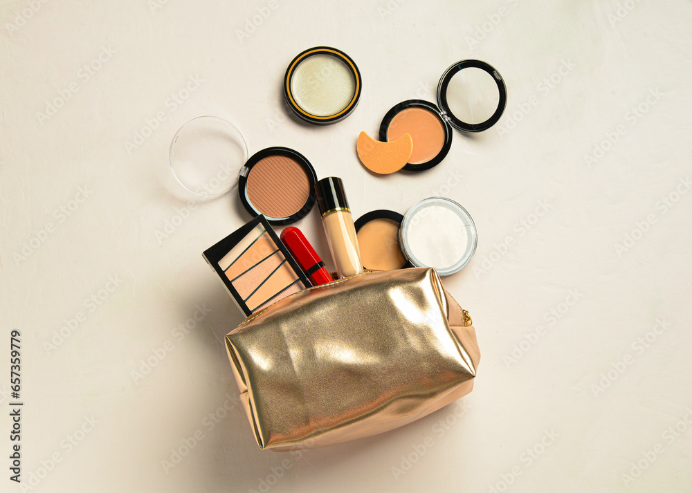 Bag with decorative cosmetic products on beige background