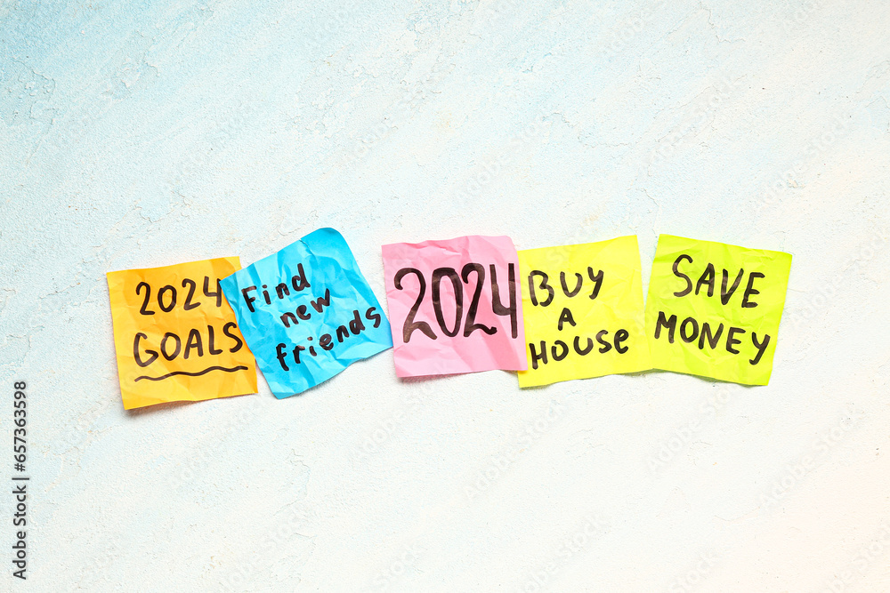 Sticky notes with different goals for 2024 on gradient background