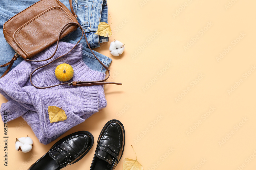 Composition with stylish female clothes, accessories and autumn decor on color background