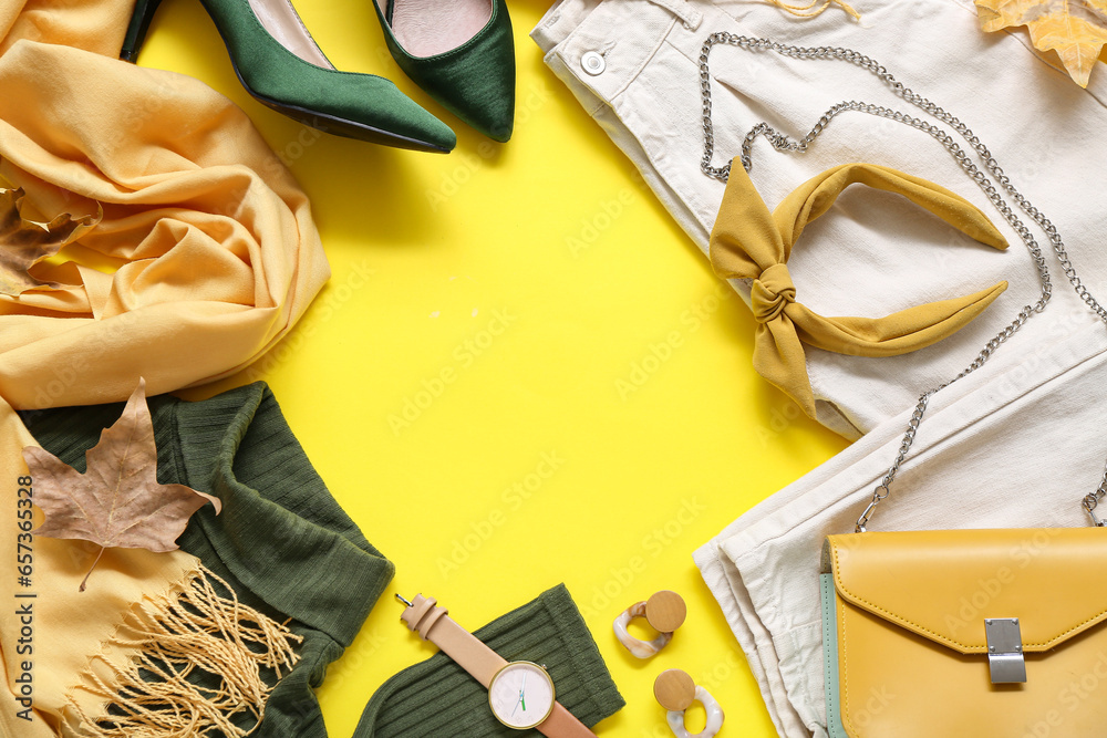 Frame made of stylish female clothes and accessories on yellow background