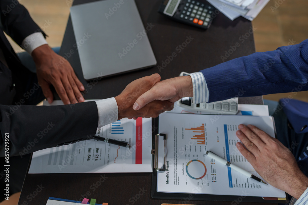 Business people shaking hands together, Business partnership handshake concept.Photo two coworkers handshaking process.Successful deal after great meeting