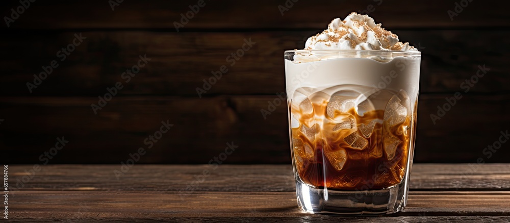 Irish whiskey and whipped cream in coffee served on rustic wooden surface