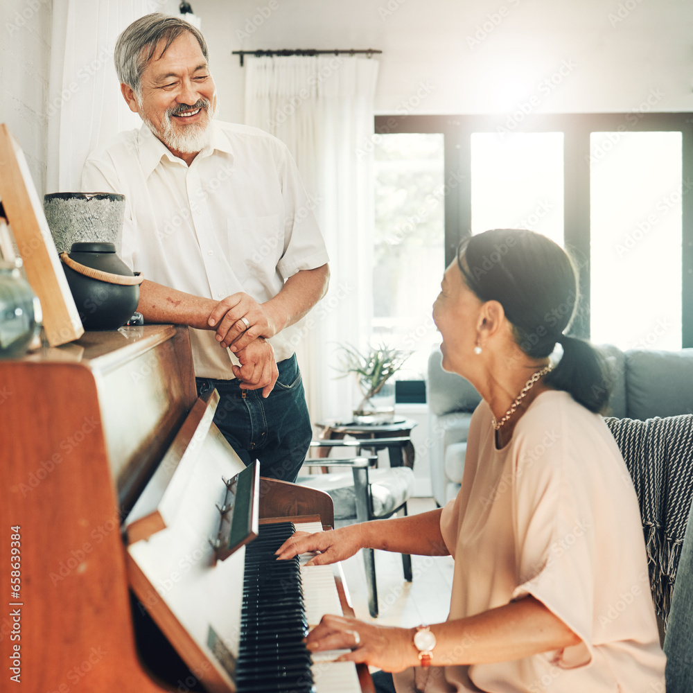 Elderly couple playing piano for music in living room for bonding, entertainment or having fun. Happy, smile and senior Asian man and woman in retirement enjoying keyboard instrument at modern home.