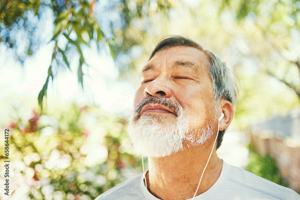 Breathe, fitness and senior man in nature on a break after a running exercise for race training. Health, sports and elderly male athlete runner after a cardio workout in outdoor park or garden.