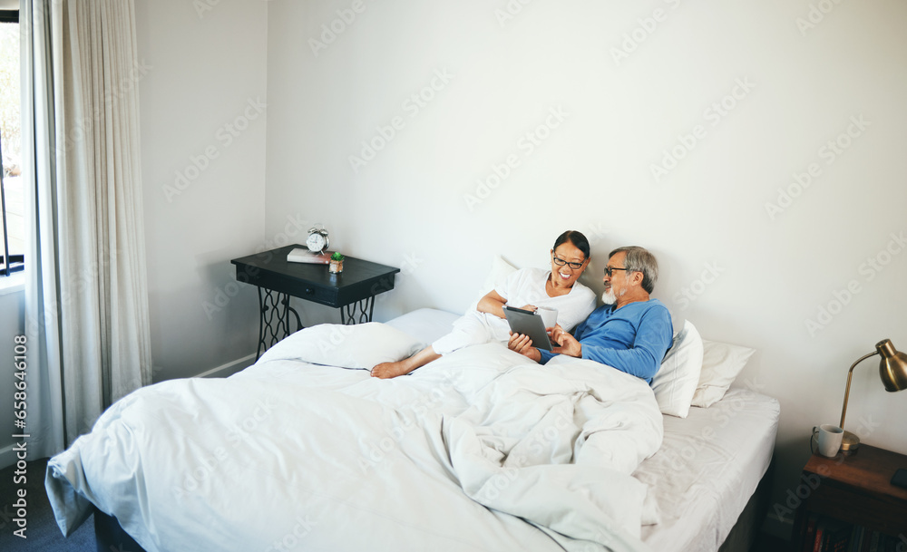 Tablet, senior or couple in bed on social media for communication on website or internet. People, bedroom or mature woman talking with an elderly man online streaming on technology or app at home