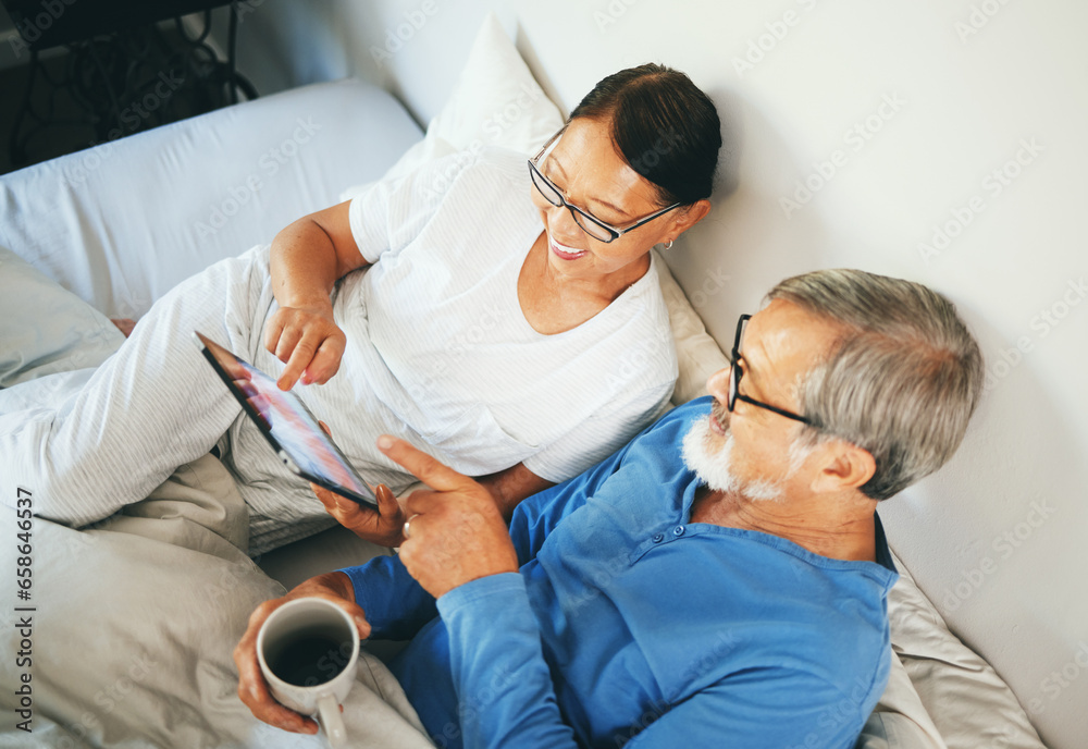 Tablet, senior or happy couple in bed to scroll on social media for communication on website or internet. Top view, home or mature woman reading news with coffee or Asian man online streaming on tech