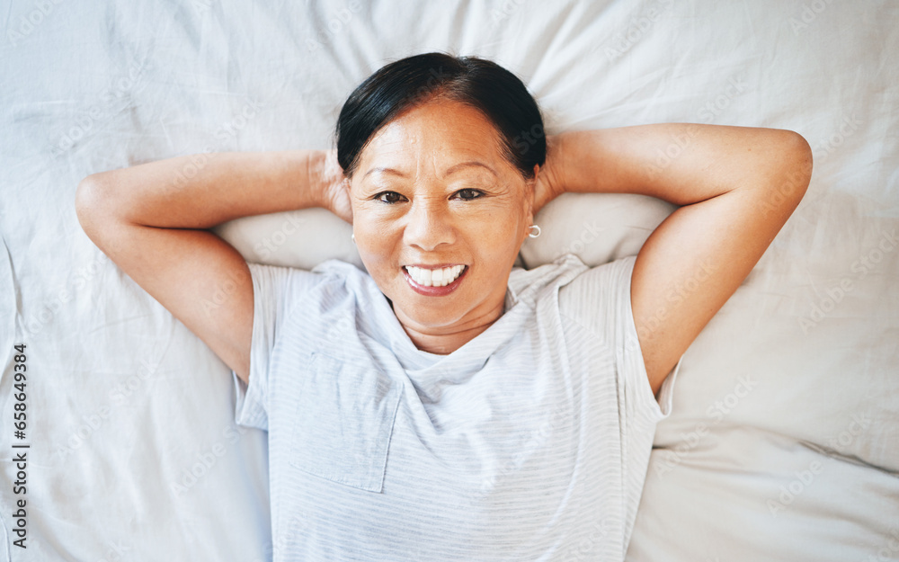 Bed, portrait and happy mature woman sleeping, tired or nap for stress relief, morning wellness or retirement rest. Top view, happiness or relax Asian person cozy, dream or exhausted in home bedroom